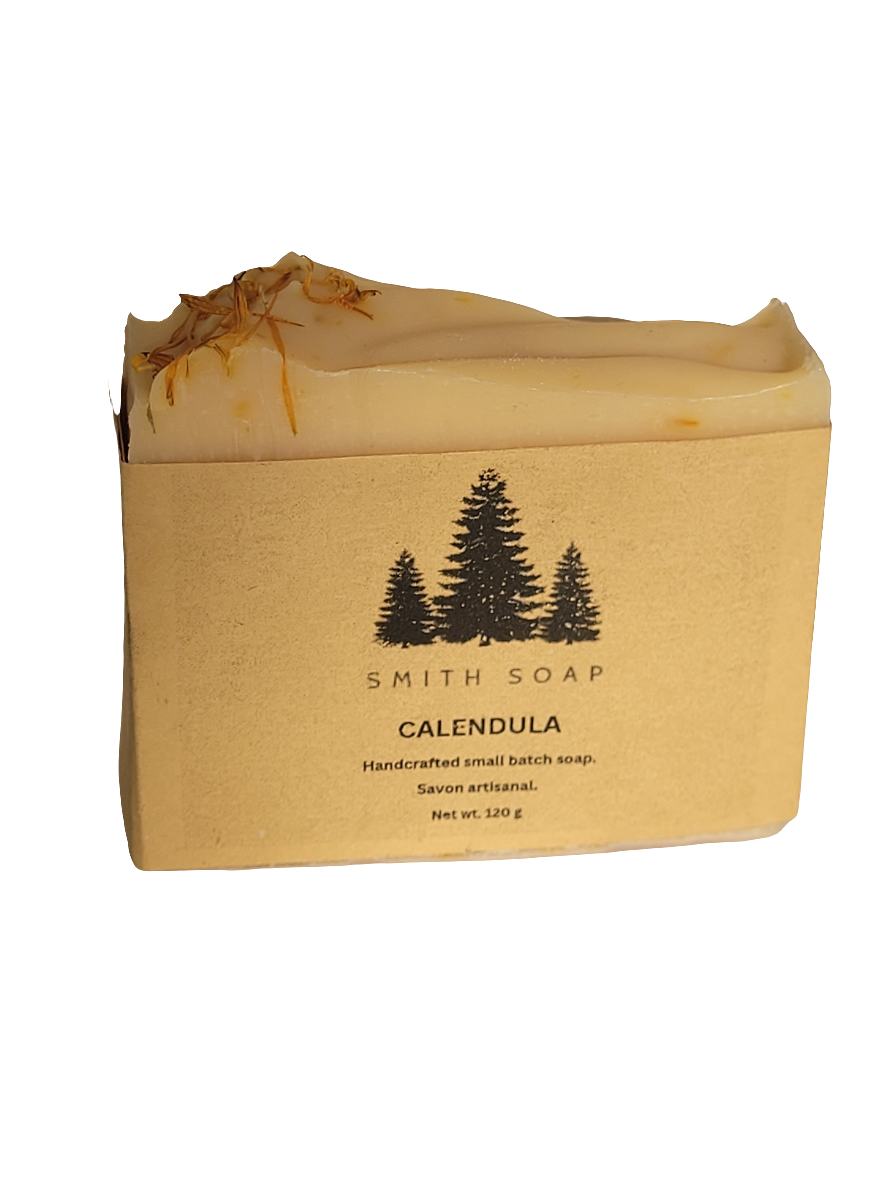 Bar of soap with calendula petals on top.