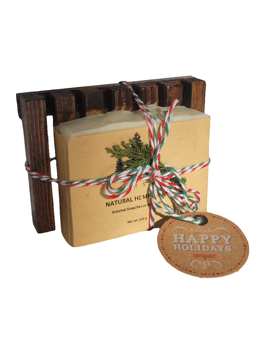 Bar of soap and bamboo soap dish tied with red and green ribbon and Christmas gift tag.