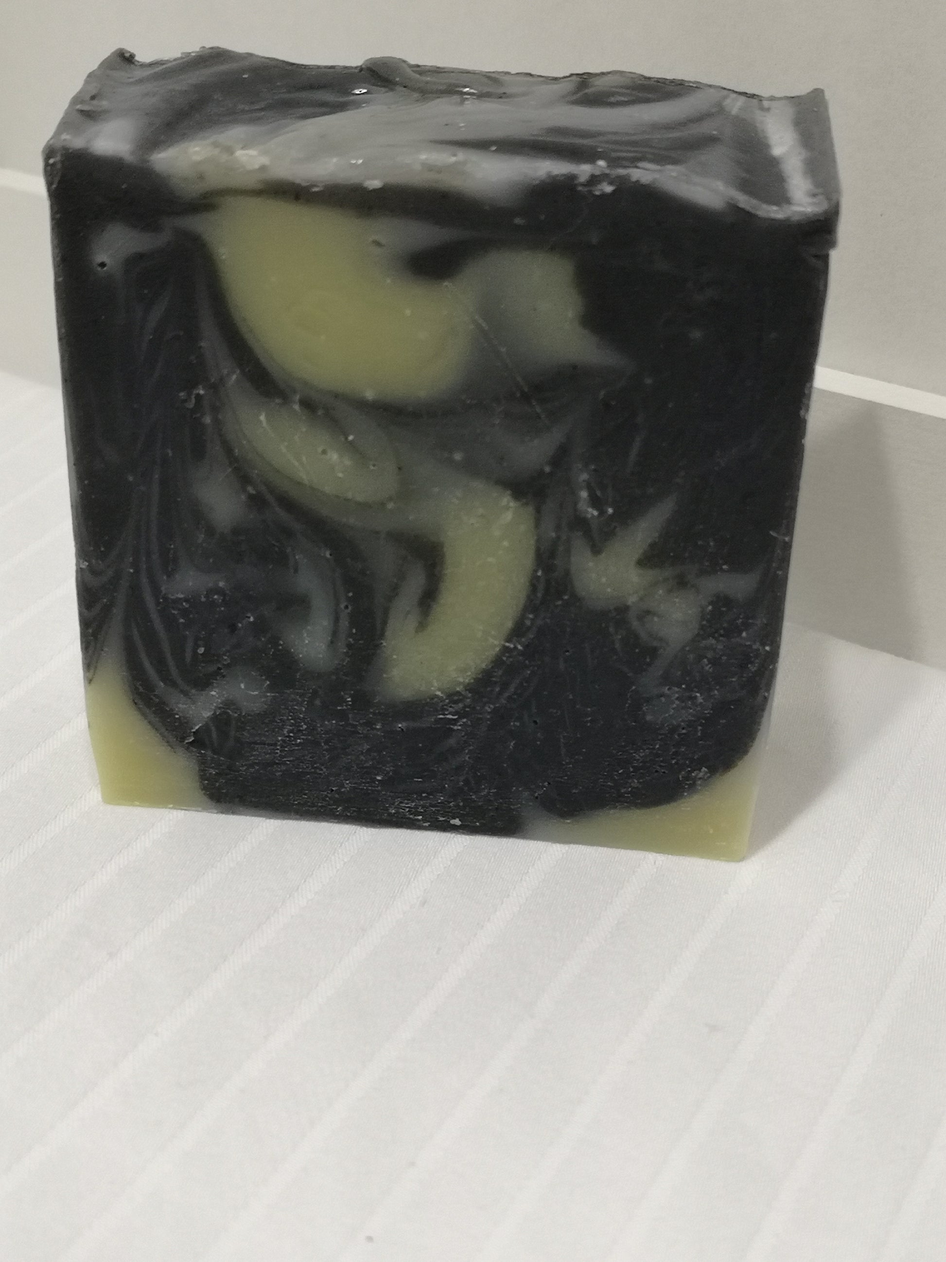 One bar of soap. Black with creamy off-white swirls. 
